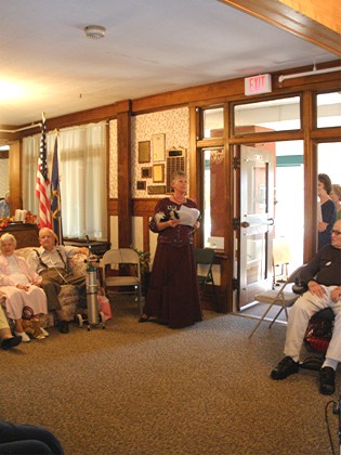 Associate Grand Matron Margo Hellickson leads entertainment, Masonic Home Tea, 9/12/09