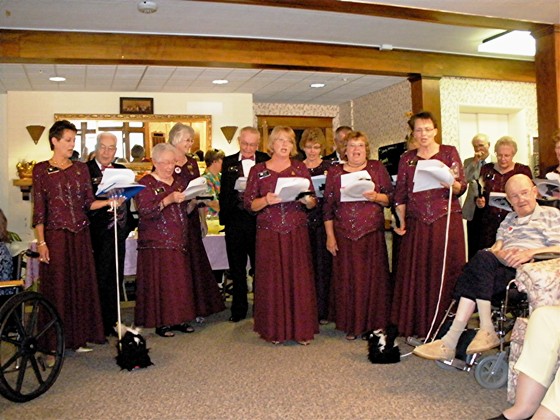 The Grand Officers sing....accompanied by WGM Billeta's mascots, skunks, Masonic Home Tea, 9/12/09